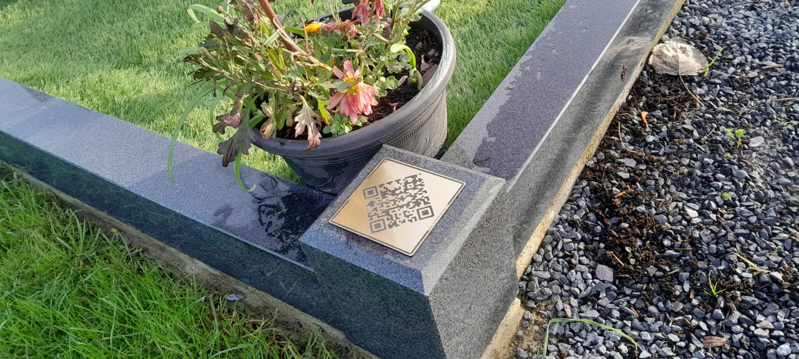 Memorial plaque displayed at a grave